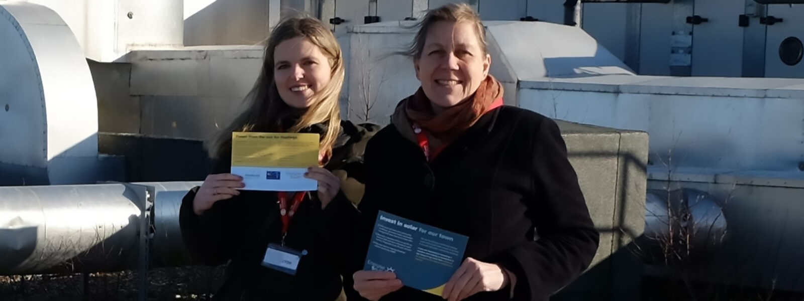 Kate Meakin and Julia Hilton with a solar installation at The Hastings Academy